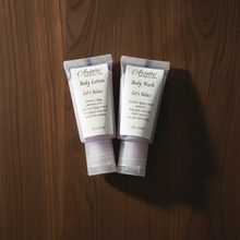 Load image into Gallery viewer, Let's Relax Body Wash and Lotion sample duo on dark woodgrain background